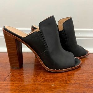 Pour La Victoire high heeled mules in black with studded detail